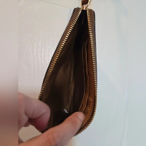 Celebrate the season with this stylish Coach wristlet wallet featuring a winter- - Picture 3 of 3